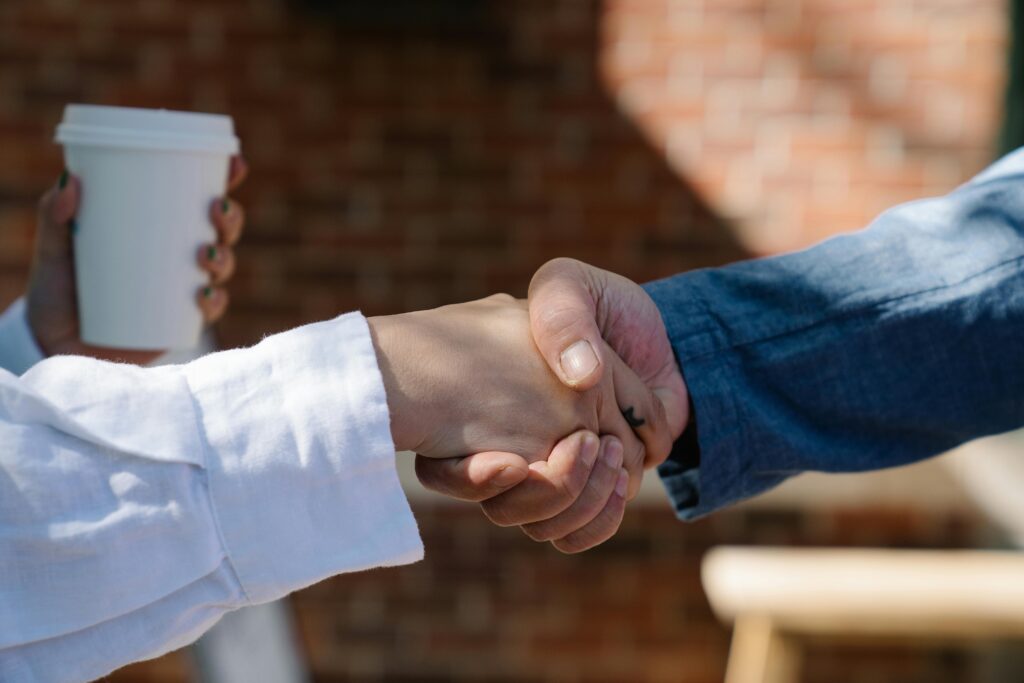Two people shaking hands.