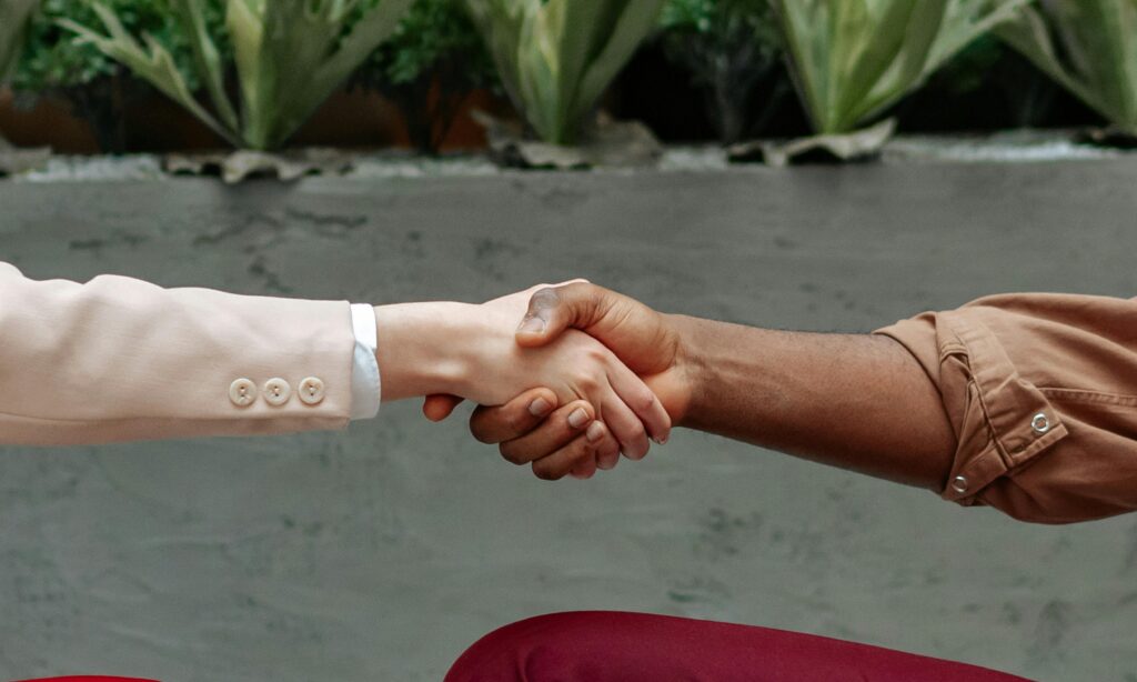 Two people shaking hands.